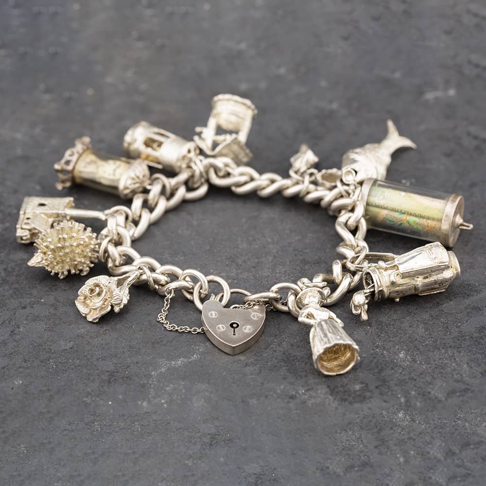 Product photograph of Pre-owned Vintage Silver 11 Assorted Charms 7 25 Inch Charm Bracelet 41251372 from The Jewel Hut