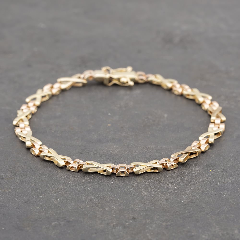 Product photograph of Pre-owned 9ct Two Colour Gold Amp Kiss Link 8 Inch Chain Bracelet 41281321 from The Jewel Hut