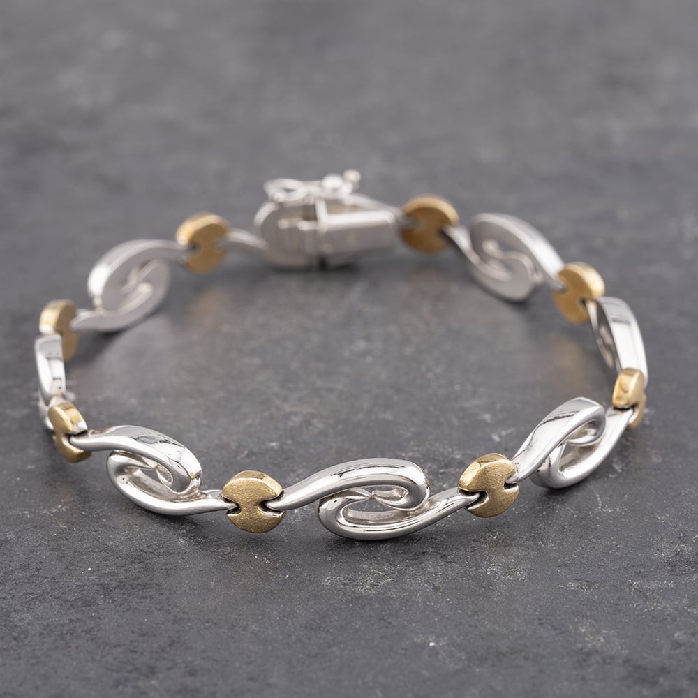 Product photograph of Pre-owned 9ct Two Colour Gold Swirls 7 5 Inch Bracelet 41281395 from The Jewel Hut
