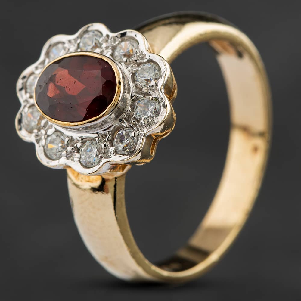 Product photograph of Pre-owned 9ct Yellow Gold Garnet Amp Cubic Zirconia Oval Halo Ring 4129503 from The Jewel Hut