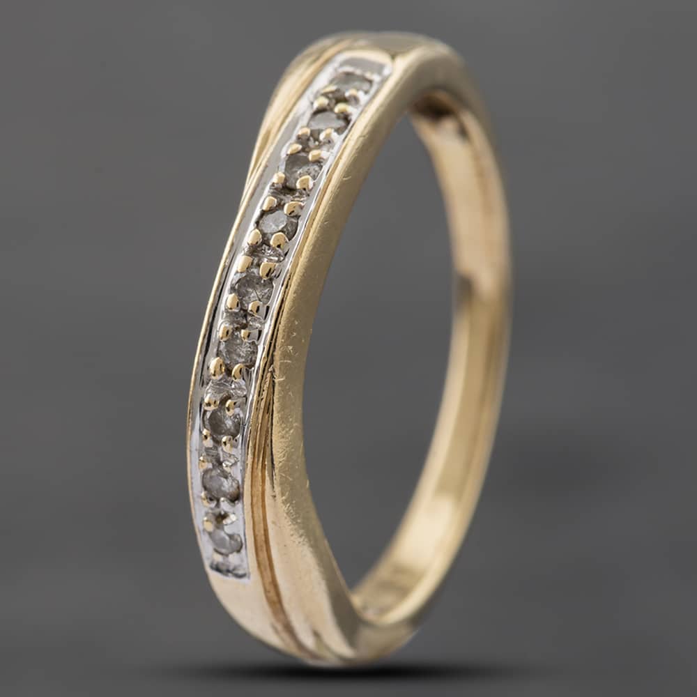 Product photograph of Pre-owned 9ct Yellow Gold Brilliant Cut Diamond Crossover Half Eternity Ring 41381916 from The Jewel Hut