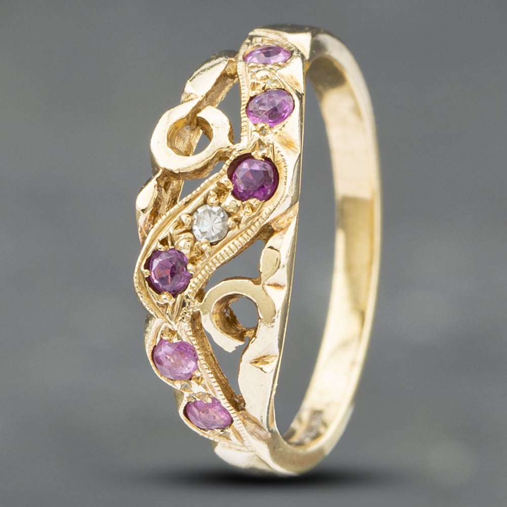 Product photograph of Pre-owned 9ct Yellow Gold Ruby Amp Diamond Swirls Dress Ring 41382205 from The Jewel Hut