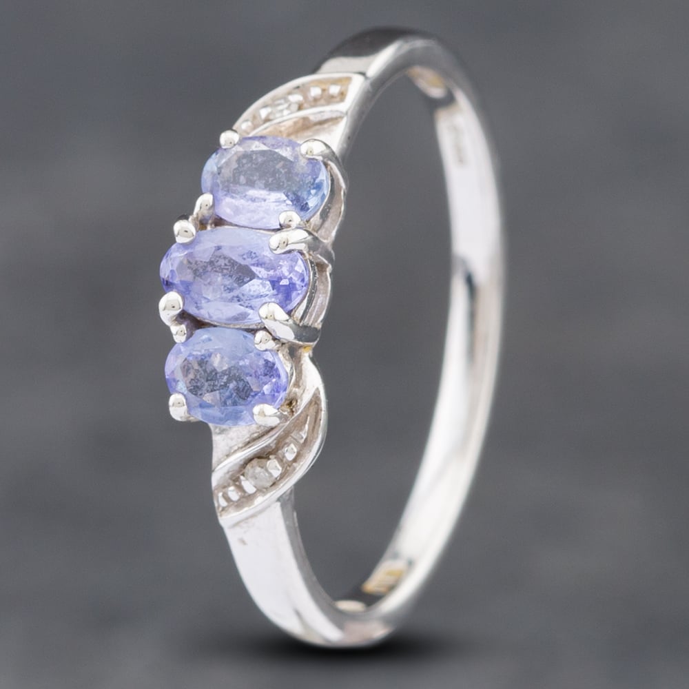 Product photograph of Pre-owned 9ct White Gold Tanzanite Amp Diamond Three Stone Ring 41382311 from The Jewel Hut
