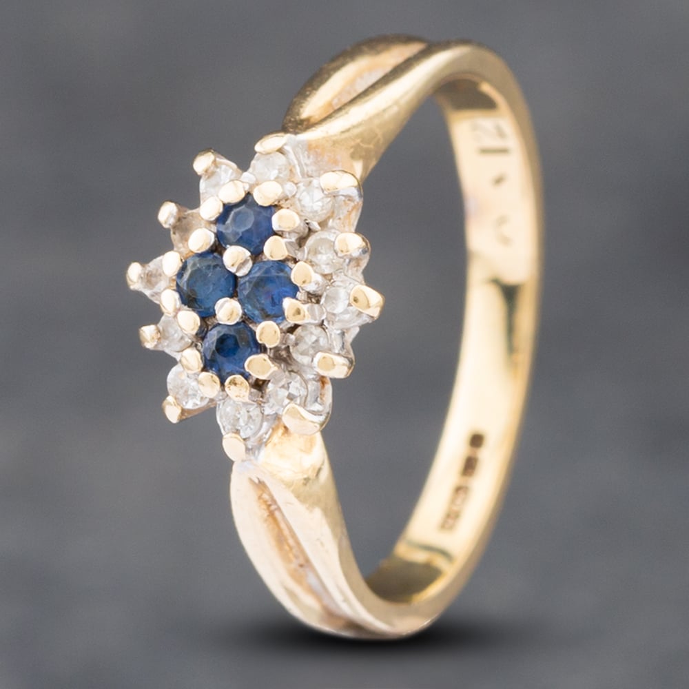 Product photograph of Pre-owned 9ct Yellow Gold Sapphire Amp 0 12ct Single Cut Diamond Cluster Ring 41382337 from The Jewel Hut
