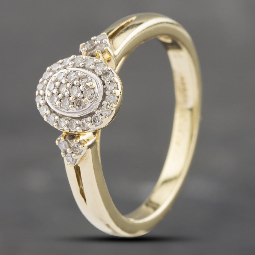 Product photograph of Pre-owned 9ct Yellow Gold 0 14ct Brilliant Cut Diamond Oval Cluster Ring 41382365 from The Jewel Hut