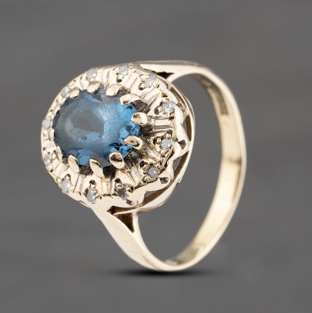 Click to view product details and reviews for Pre Owned 9ct Yellow Gold Blue Topaz And 012ct Diamond Large Oval Cluster Ring 41383590.