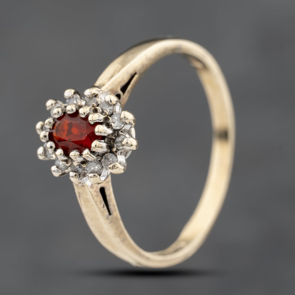 Click to view product details and reviews for Pre Owned 9ct Yellow Gold Garnet And 010ct Diamond Cluster Ring 41383818. Click to view product details and reviews for Pre Owned 9ct Yellow Gold Garnet And 010ct Diamond Cluster Ring 41383818.