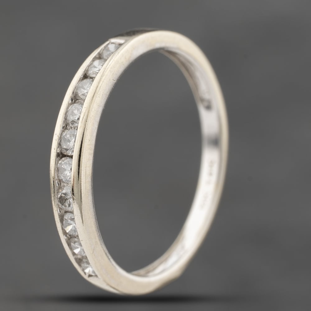 Click to view product details and reviews for Pre Owned 14ct White Gold 020ct Brilliant Cut Diamond Channel Set Half Eternity Ring 41383829.