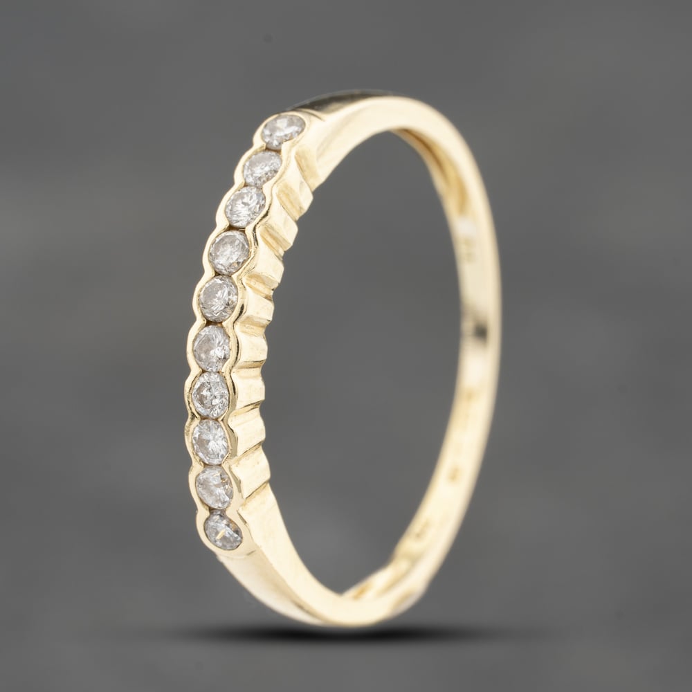 Click to view product details and reviews for Pre Owned 18ct Yellow Gold 025ct Brilliant Cut Diamond Rubover Set Half Eternity Ring 41383845.