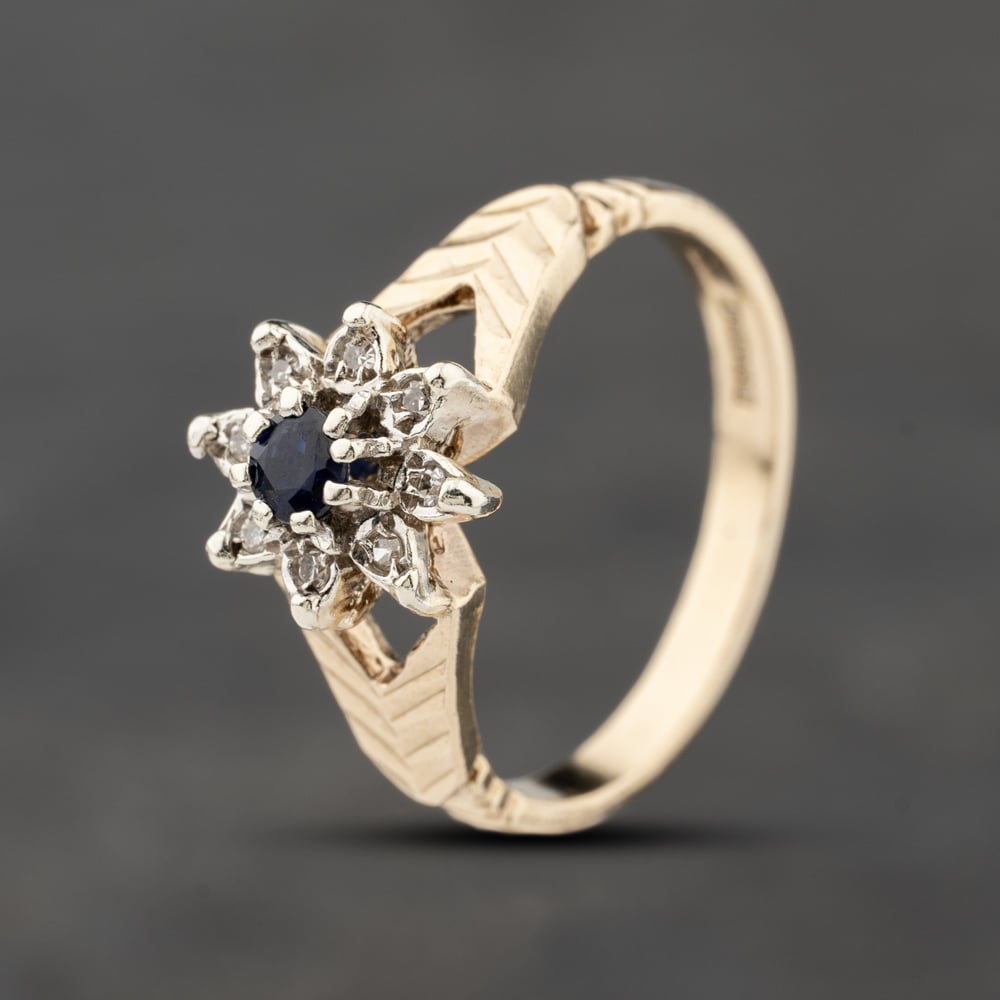 Click to view product details and reviews for Pre Owned 9ct Yellow Gold Sapphire And 003ct Diamond Flower Cluster Ring 41383877.