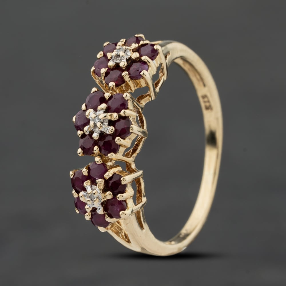 Click to view product details and reviews for Pre Owned 9ct Yellow Gold Ruby And 002ct Diamond Triple Flower Cluster Ring 41384003.