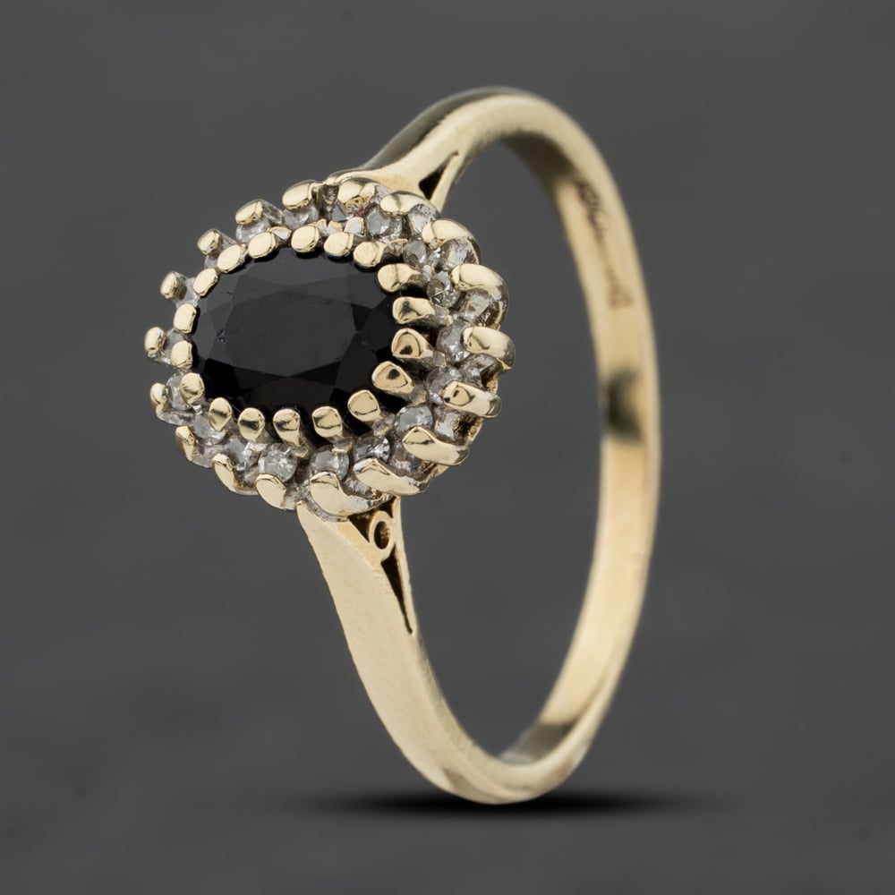 Click to view product details and reviews for Pre Owned 9ct Yellow Gold 070ct Sapphire And 018ct Diamond Oval Cluster Ring 41384023. Click to view product details and reviews for Pre Owned 9ct Yellow Gold 070ct Sapphire And 018ct Diamond Oval Cluster Ring 41384023.