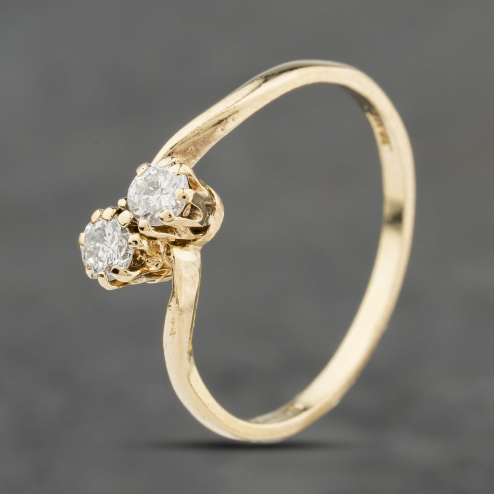Click to view product details and reviews for Pre Owned 9ct Yellow Gold 025ct Brilliant Cut Diamond Twist Two Stone Ring 41384077.
