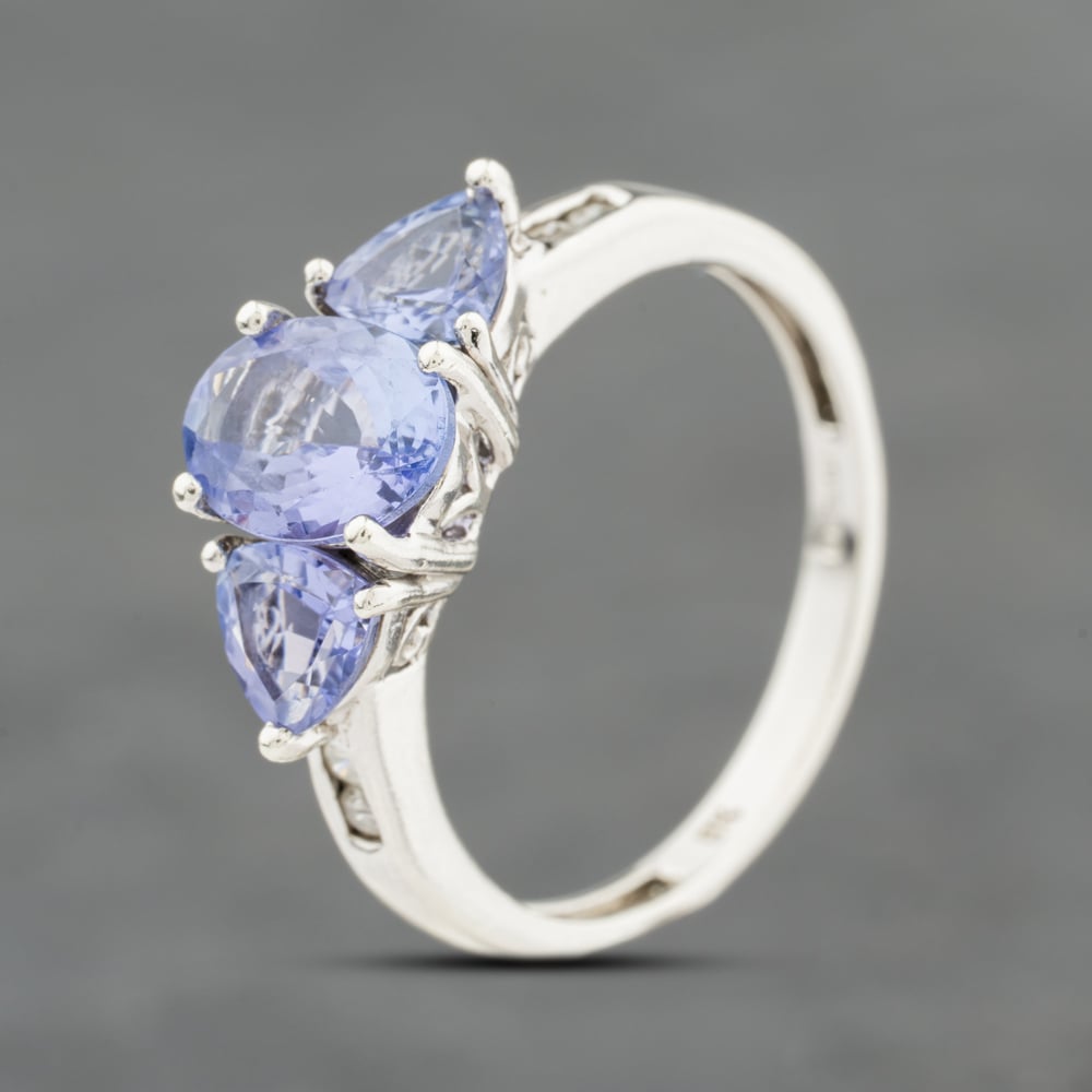 Click to view product details and reviews for Pre Owned 9ct White Gold Tanzanite And 004ct Brilliant Cut Diamond Three Stone Ring 41384120.
