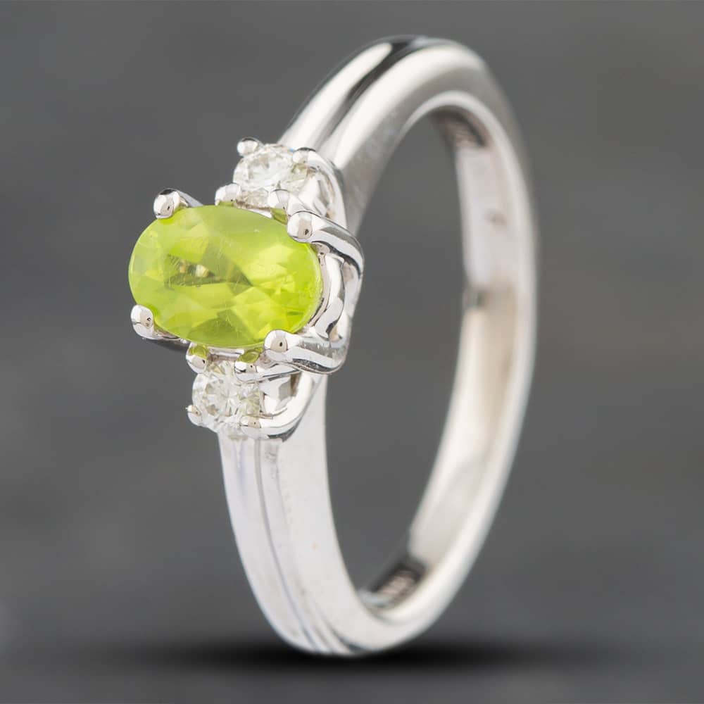 Product photograph of Pre-owned 18ct White Gold Peridot Three Stone Ring 41481179 from The Jewel Hut