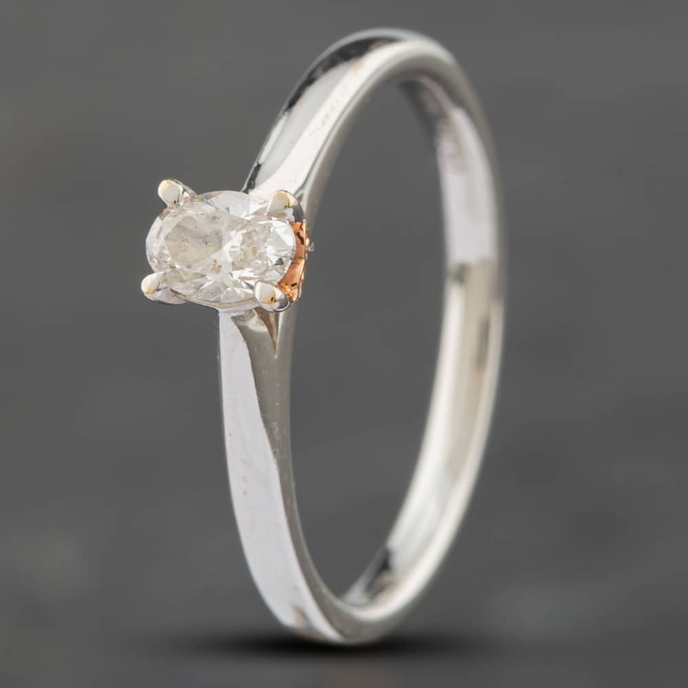 Product photograph of Pre-owned 18ct Two Colour Gold 0 25ct Oval Cut Diamond Oval Solitaire Ring 41481218 from The Jewel Hut