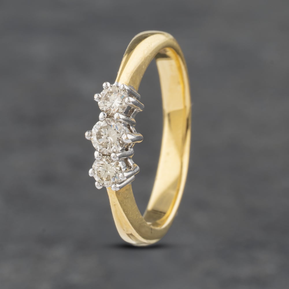 Click to view product details and reviews for Pre Owned 18ct Yellow Gold 030ct Brilliant Cut Diamond Three Stone Ring 41481887.