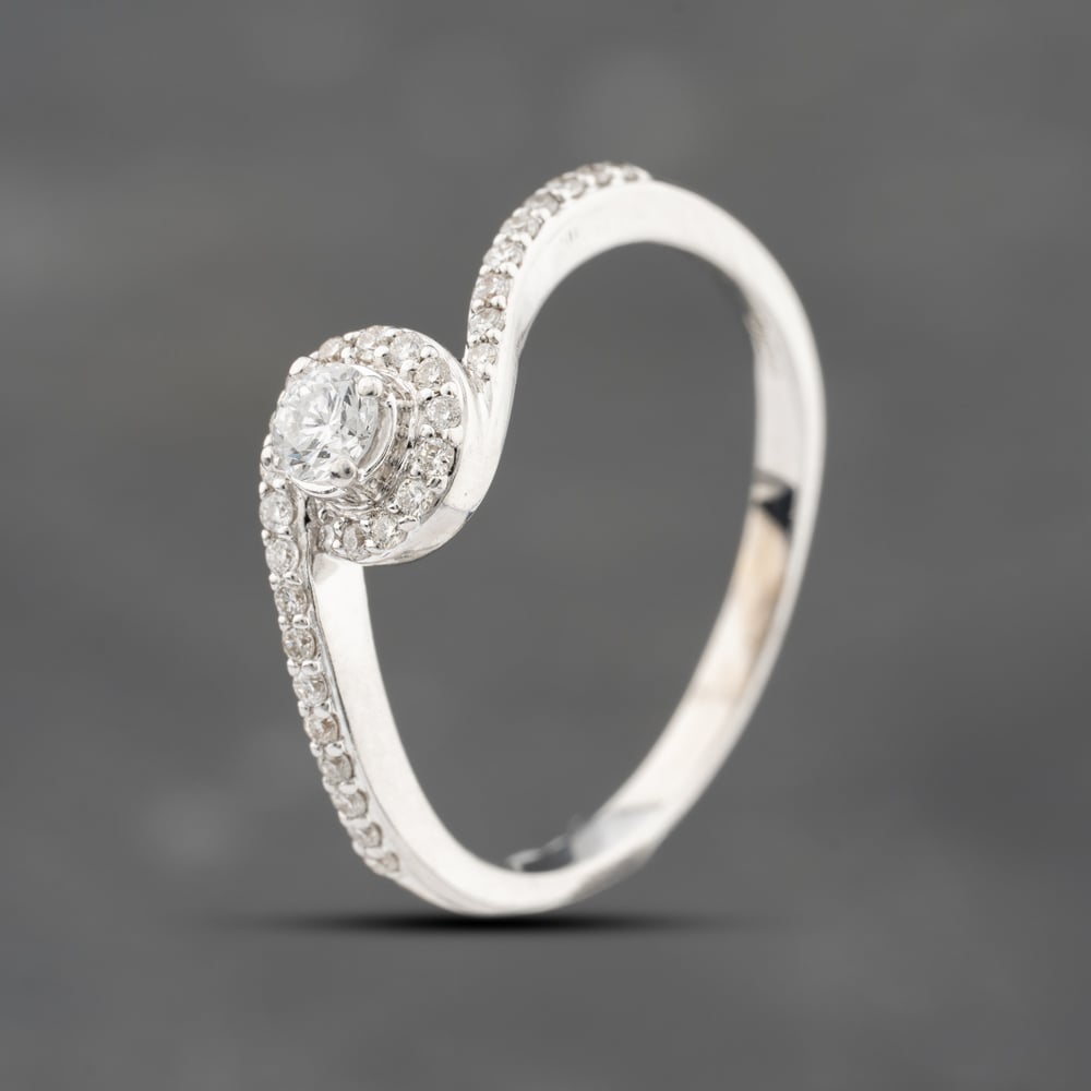 Click to view product details and reviews for Pre Owned 18ct White Gold 033ct Brilliant Cut Diamond Twist Shoulder Set Solitaire Ring 41482017.