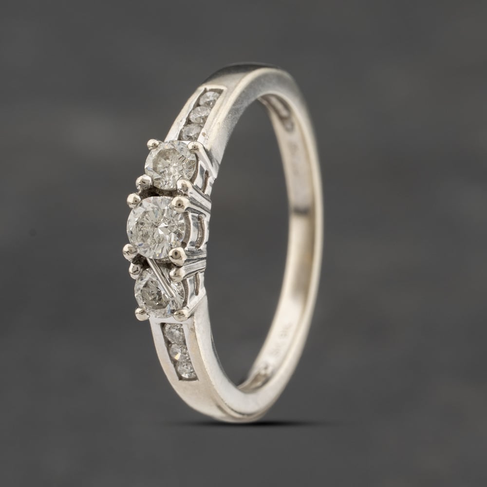 Click to view product details and reviews for Pre Owned 9ct White Gold 033ct Diamond With Diamond Set Shoulders Three Stone Ring 41482136.