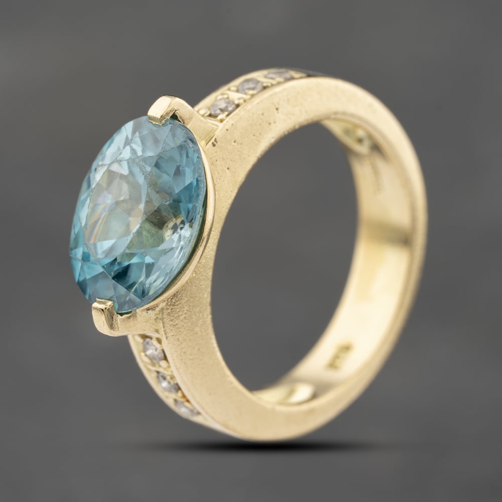 Click to view product details and reviews for Pre Owned 14ct Yellow Gold Blue Zircon Zircon And 012ct Diamond Tension Set Dress Ring 41482288.