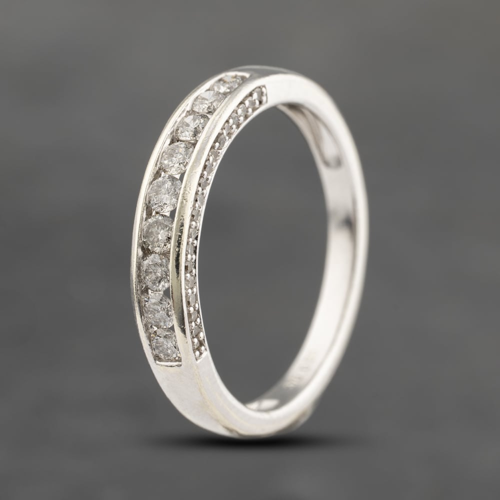 Click to view product details and reviews for Pre Owned 9ct White Gold 050ct Brilliant Cut Diamond Channel Set Half Eternity Ring 41482308.