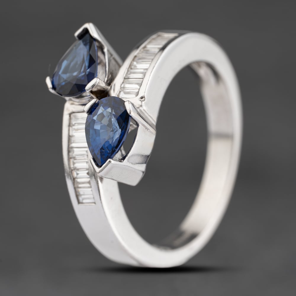 Click to view product details and reviews for Pre Owned 18ct White Gold Sapphire And 033ct Baguette Cut Diamond Crossover Dress Ring 41482335.