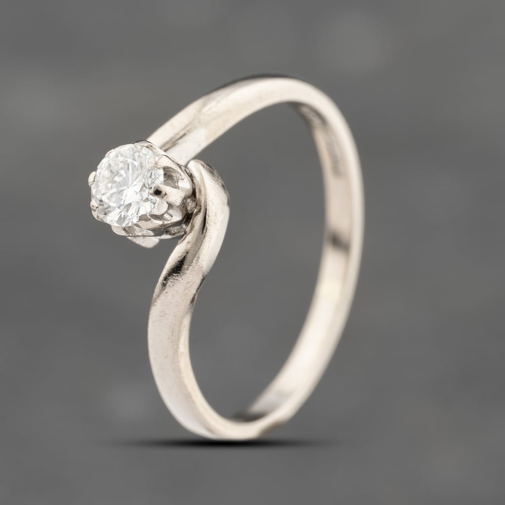Click to view product details and reviews for Pre Owned 18ct White Gold 035ct Brilliant Cut Diamond Twist Solitaire Ring 41482340.