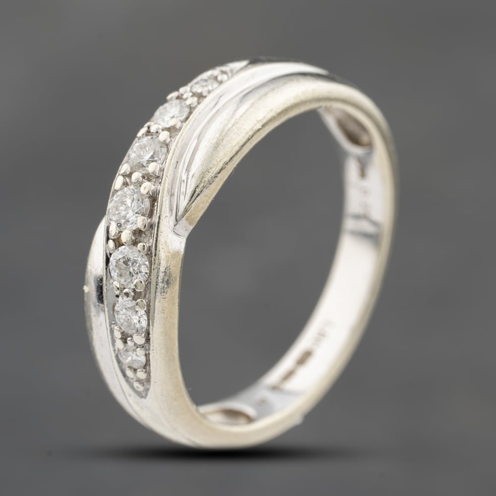 Click to view product details and reviews for Pre Owned 9ct White Gold 025ct Brilliant Cut Diamond Crossover Half Eternity Ring 41482411.