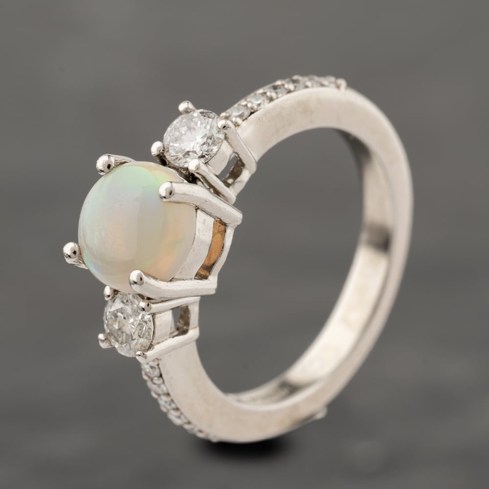 Click to view product details and reviews for Pre Owned Platinum Opal And 044ct Diamond Three Stone Ring 41482451.