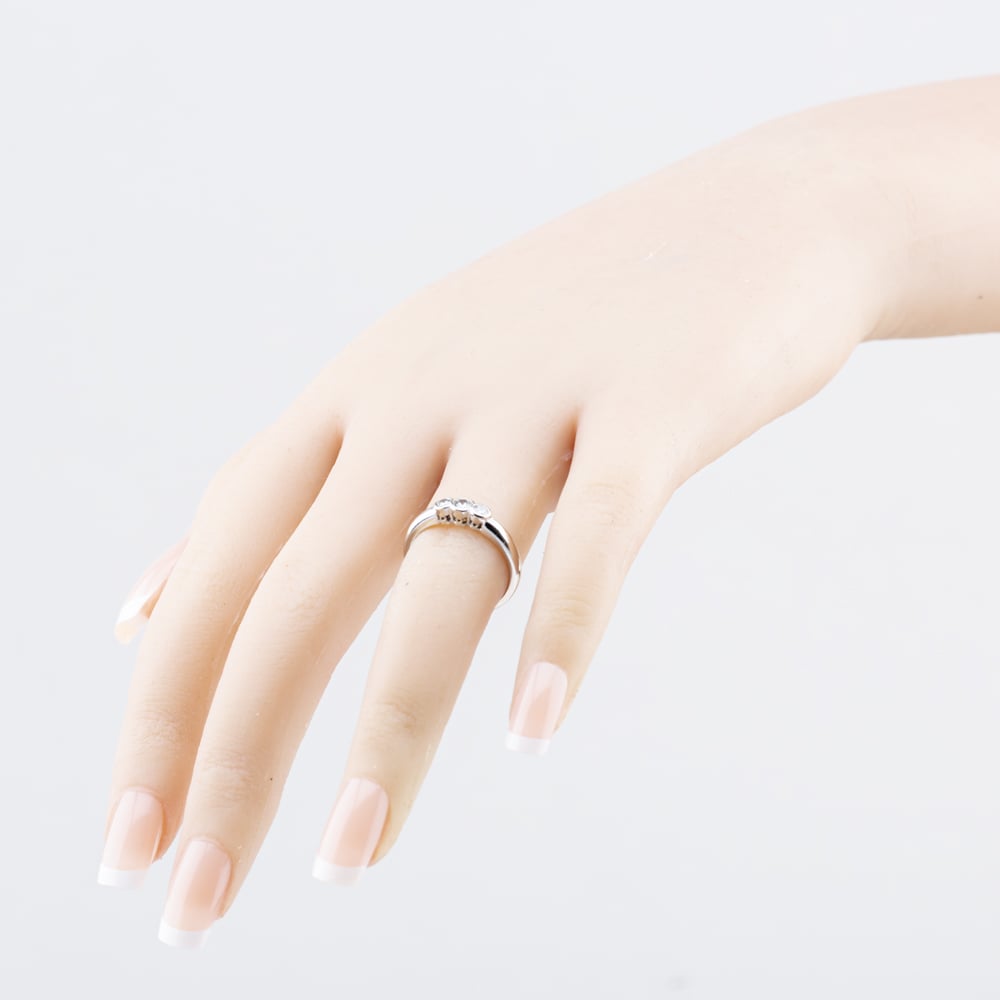 Pre-Owned 18ct White Gold 0.20ct Brilliant Cut Diamond Rub Over Set Three Stone Ring 41482827
