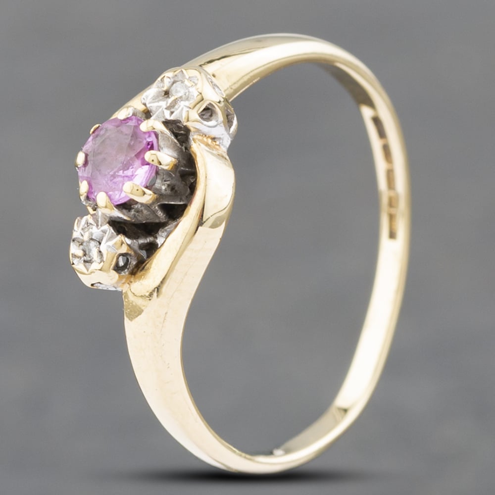 Product photograph of Pre-owned 9ct Yellow Gold Topaz Amp Diamond Twist Three Stone Ring 41671449 from The Jewel Hut