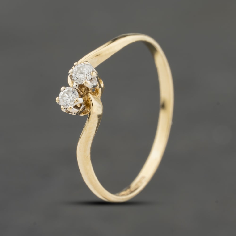 Click to view product details and reviews for Pre Owned 9ct Yellow Gold Brilliant Cut Diamond Twist Two Stone Ring 41671605.