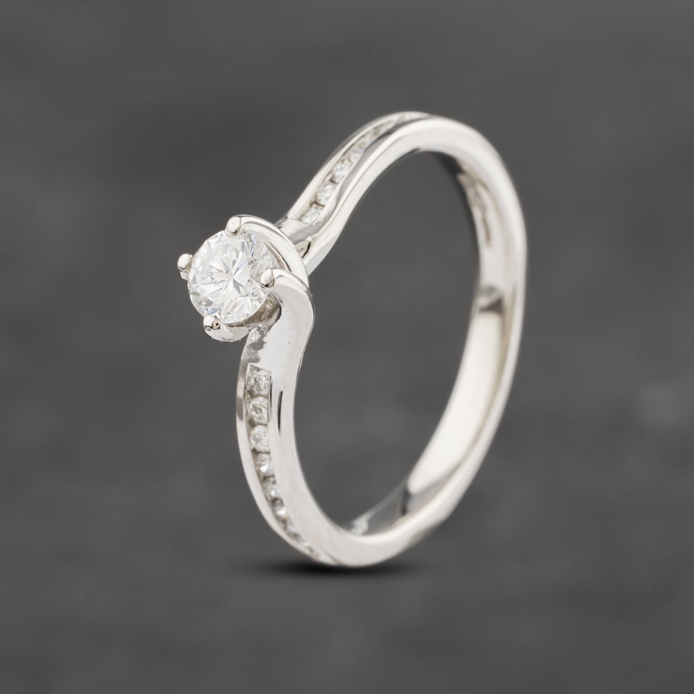 Click to view product details and reviews for Pre Owned Platinum 027ct Brilliant Cut Diamond Shoulder Set Solitaire Ring 43121064.
