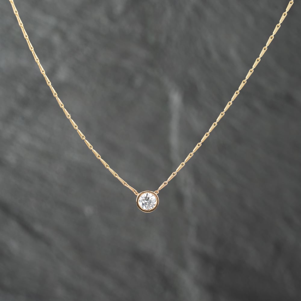 Click to view product details and reviews for Pre Owned 14ct Yellow Gold 052ct Brilliant Cut Diamond Single Stone Rubover Set Pendant And 16 Inch Trace Chain 43141222.