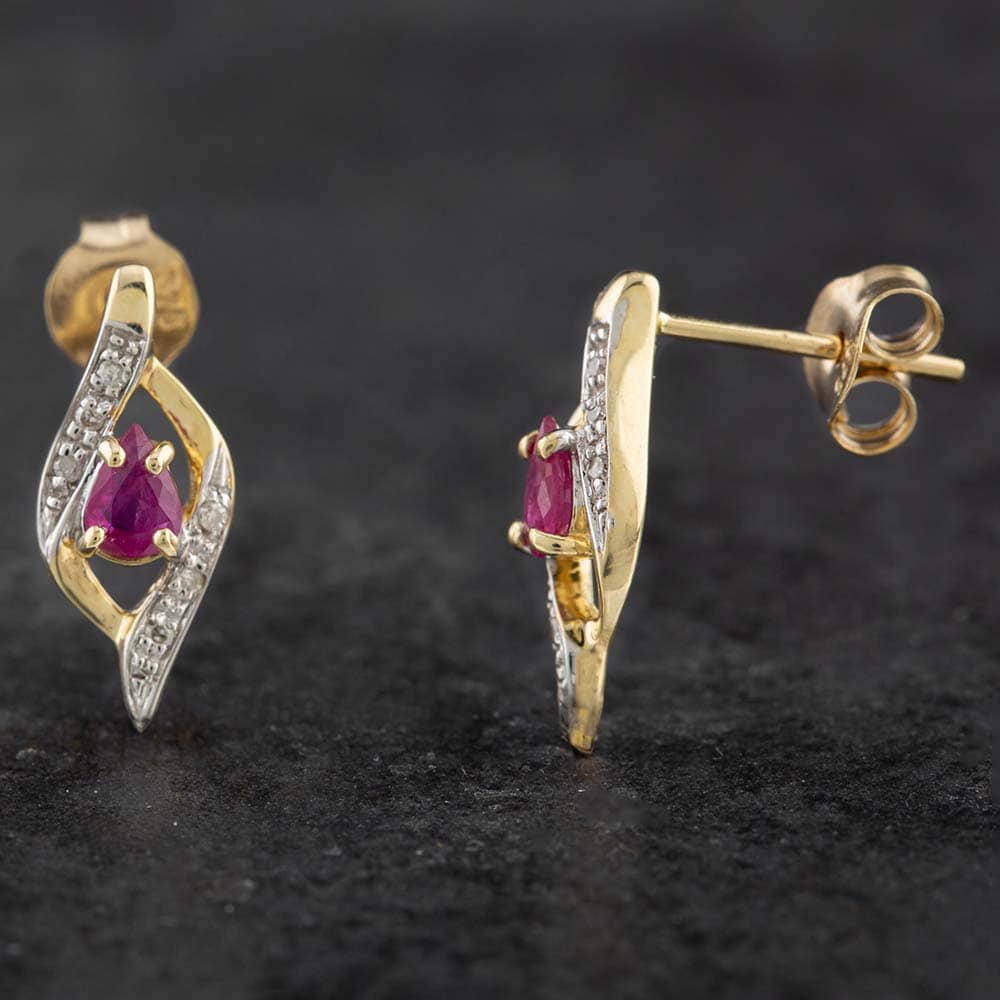 Product photograph of Pre-owned 9ct Yellow Gold 0 14ct Ruby Amp 0 15ct Brilliant Cut Diamond Stud Earrings 43170061 from The Jewel Hut