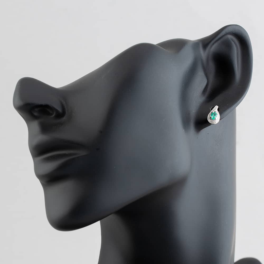 Pre-Owned White Gold 0.30ct Oval Cut Emerald & 0.03ct Diamond Swirl Stud Earrings 43171090