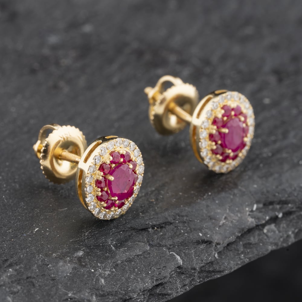 Click to view product details and reviews for Pre Owned 14ct Yellow Gold Ruby And 025ct Diamond Oval 9mm Stud Earrings 43171230.