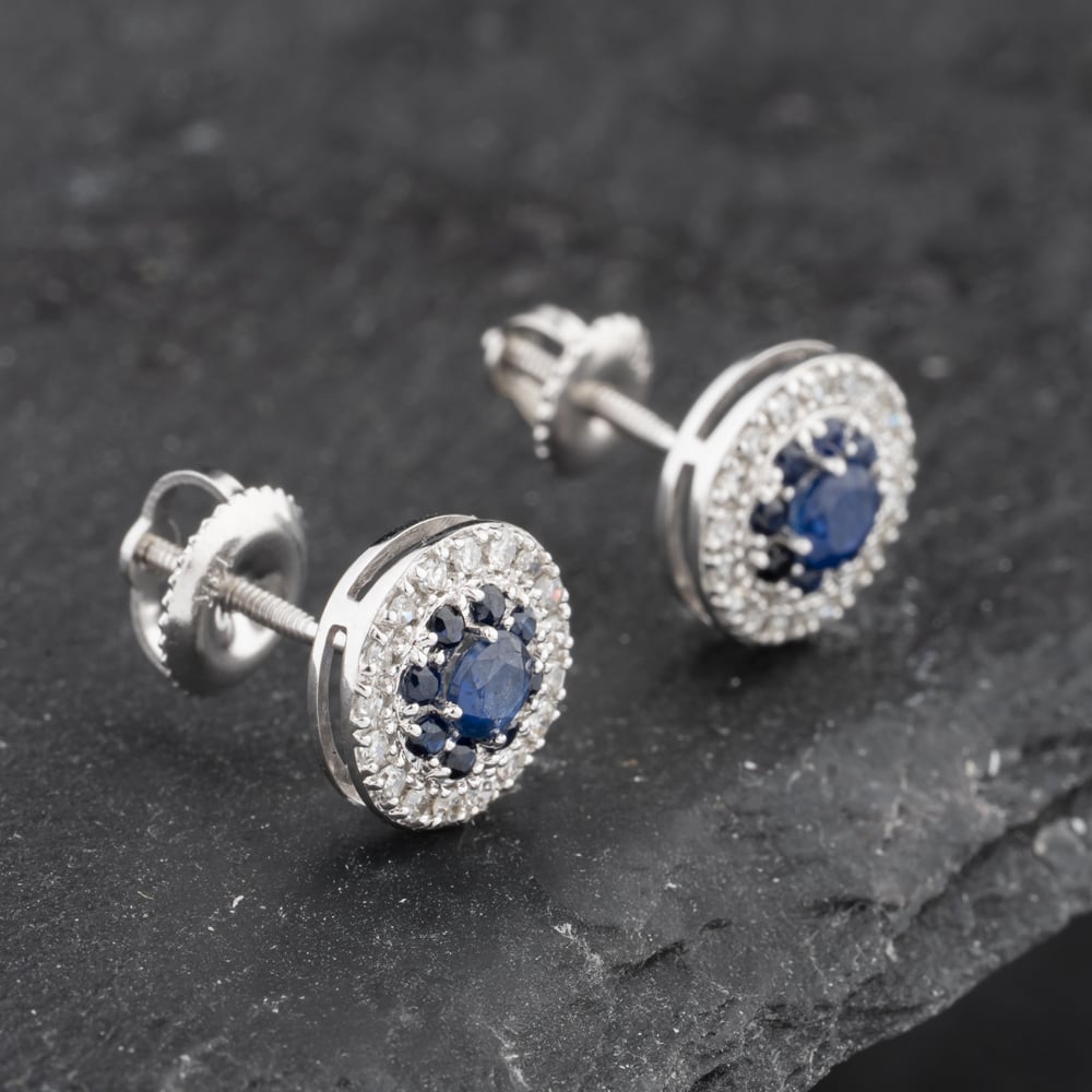 Click to view product details and reviews for Pre Owned 14ct White Gold 060ct Sapphire And 025ct Diamond Round Cluster Stud Earrings 43171232.