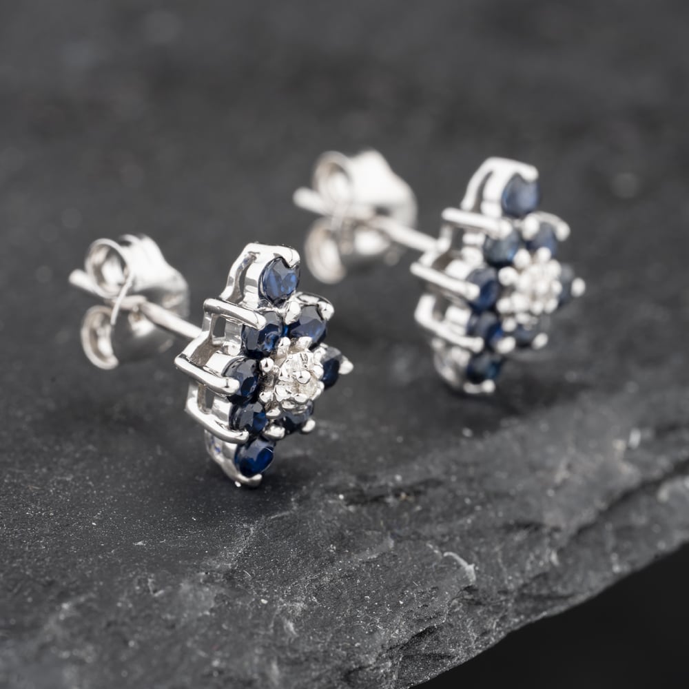 Click to view product details and reviews for Pre Owned 9ct White Gold 074ct Sapphire And Diamond Marquise Shape Cluster 10mm Stud Earrings 43171256.