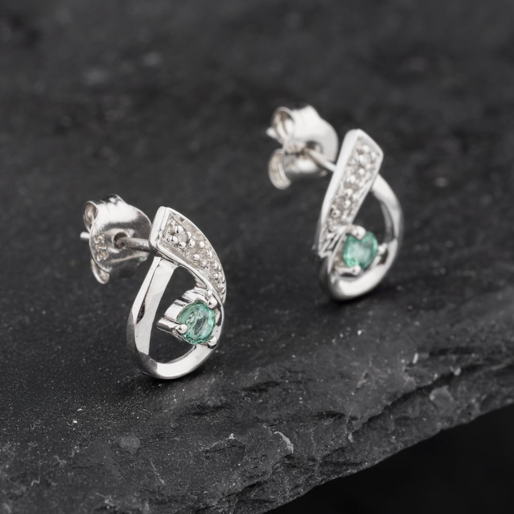 Click to view product details and reviews for Pre Owned 9ct White Gold 013ct Emerald And Diamond Open Work Swirl 12mm Stud Earrings 43171338.