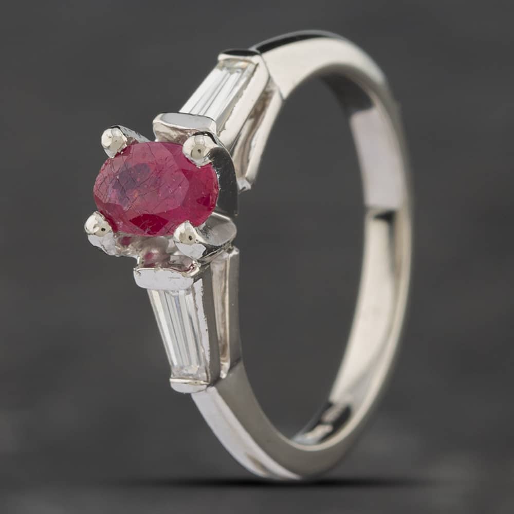 Product photograph of Pre-owned Platinum 0 68ct Glass Filled Ruby Amp Baguette Cut Diamond Three Stone Ring 43351021 from The Jewel Hut
