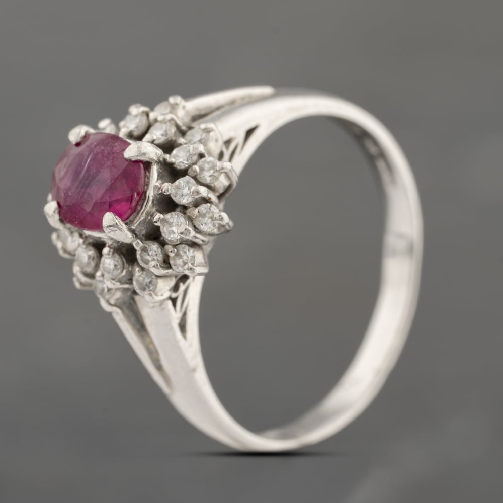 Click to view product details and reviews for Pre Owned Platinum 081ct Ruby And 026ct Brilliant Cut Diamond Oval Cluster Ring 43351054.