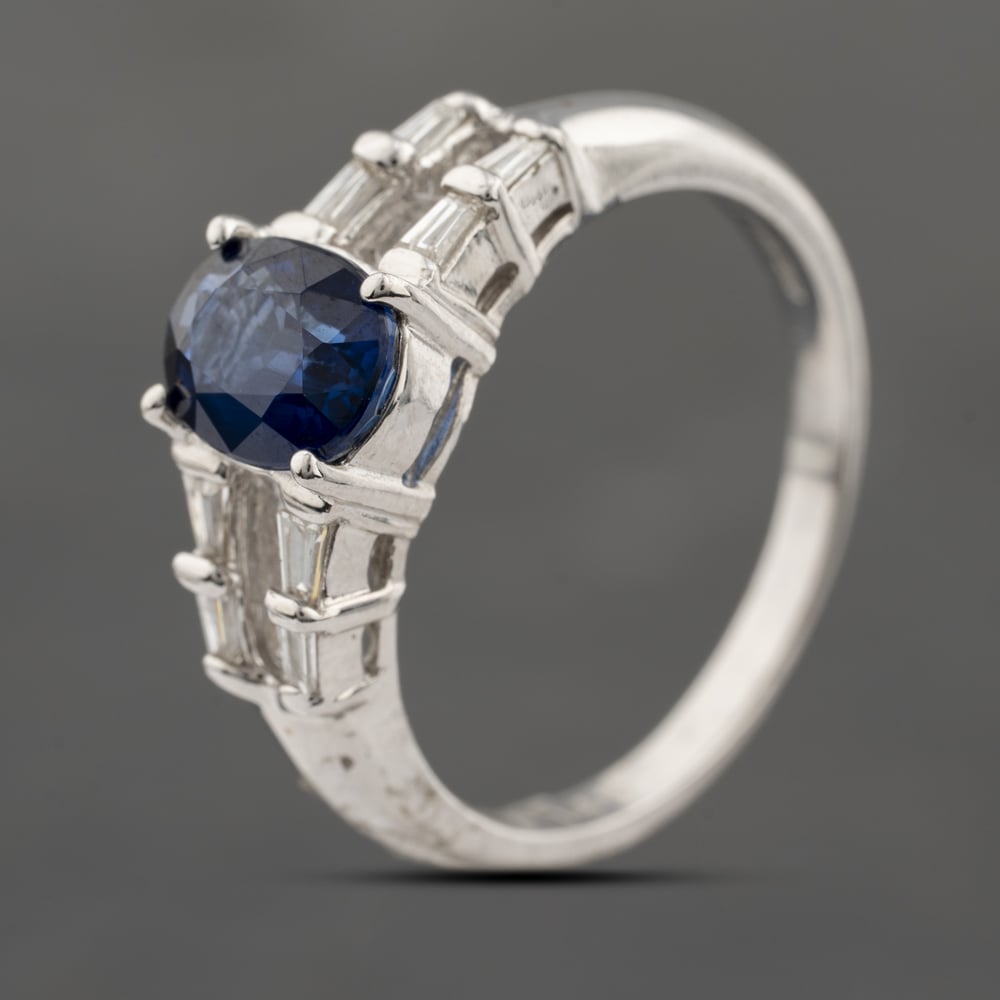 Click to view product details and reviews for Pre Owned 18ct White Gold Sapphire And 017ct Baguette Cut Diamond Oval Dress Ring 43361191.
