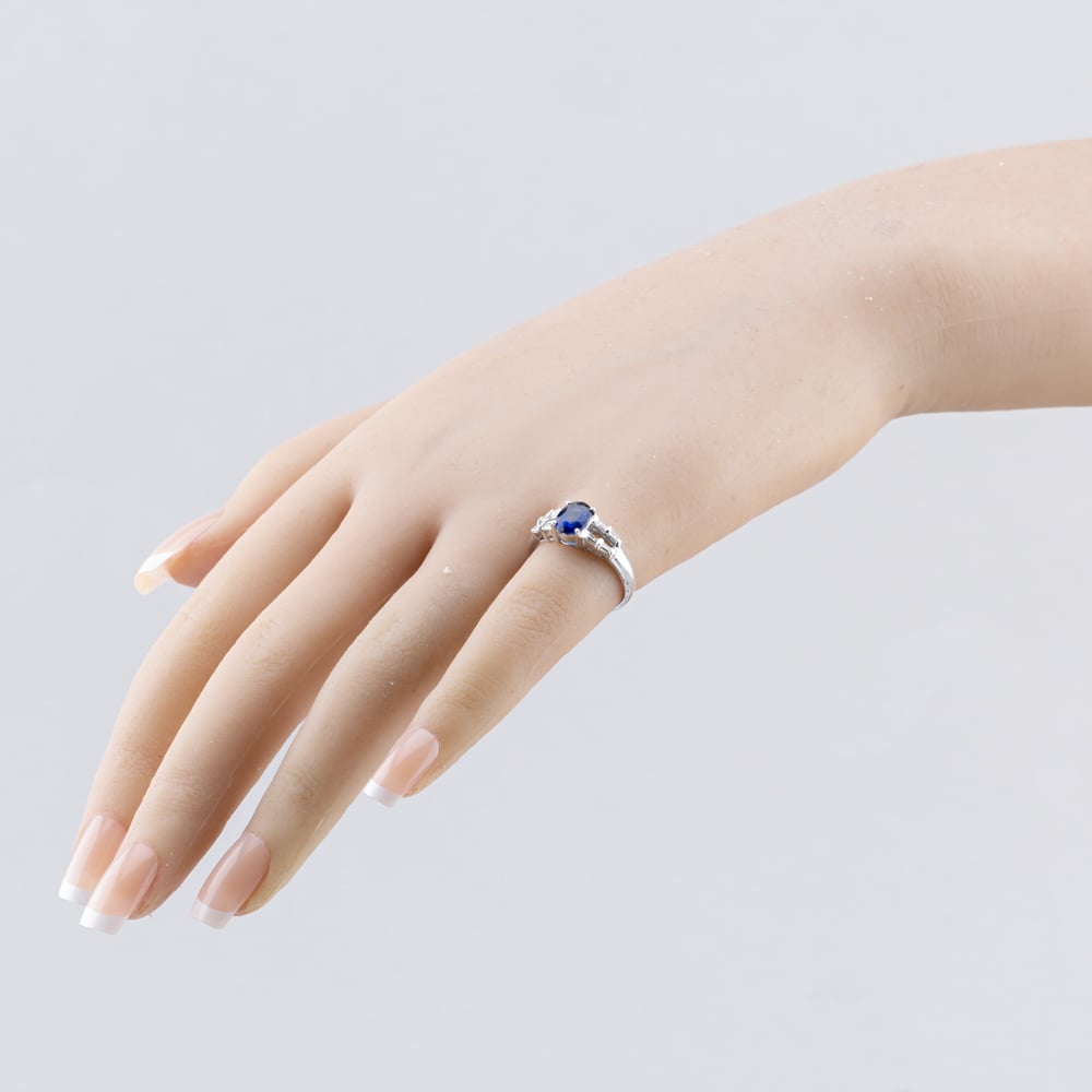 Pre-Owned 18ct White Gold Sapphire & 0.17ct Baguette Cut Diamond Oval Dress Ring 43361191