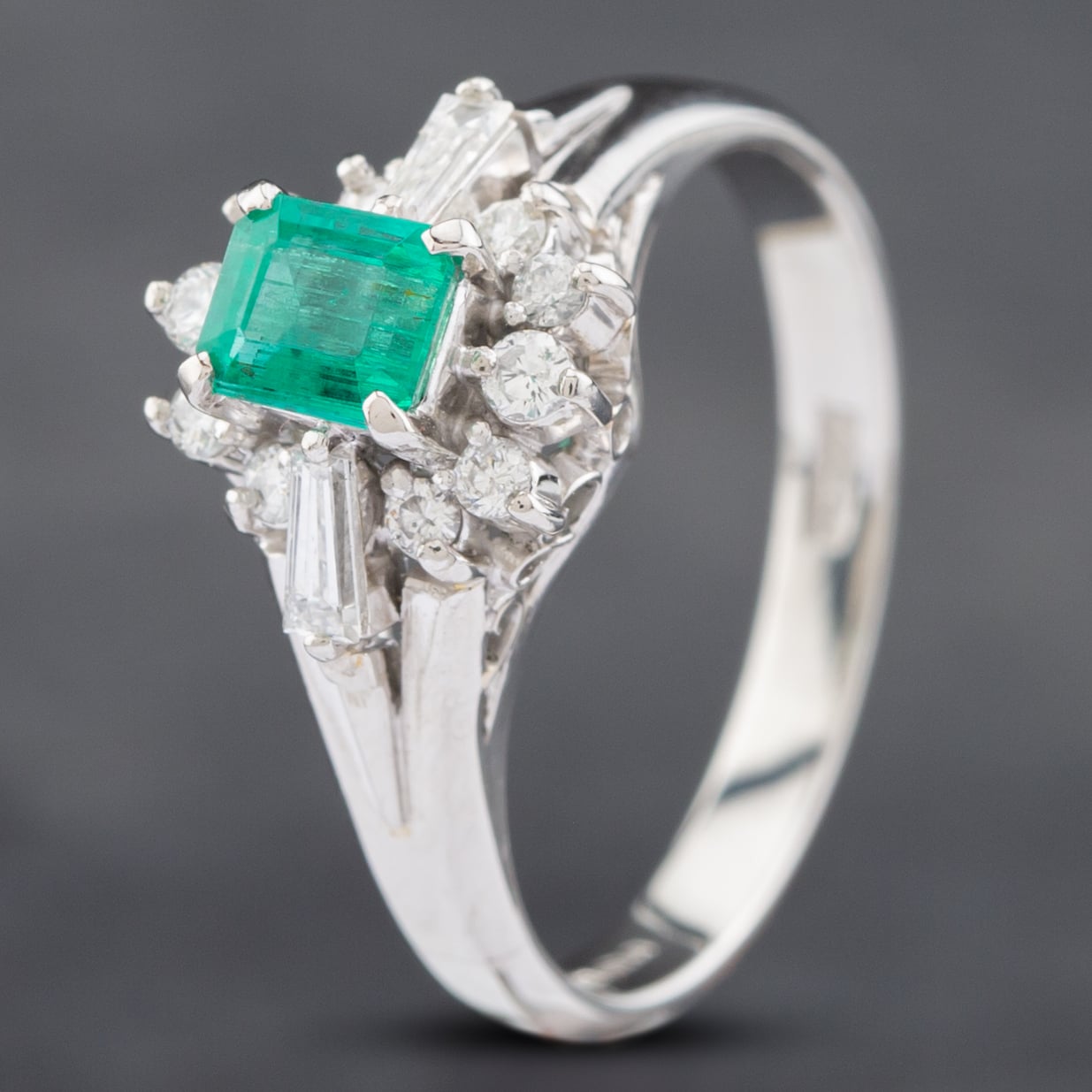 Product photograph of Pre-owned Platinum 0 43ct Emerald Amp 0 28ct Diamond Cluster Ring 43371056 from The Jewel Hut