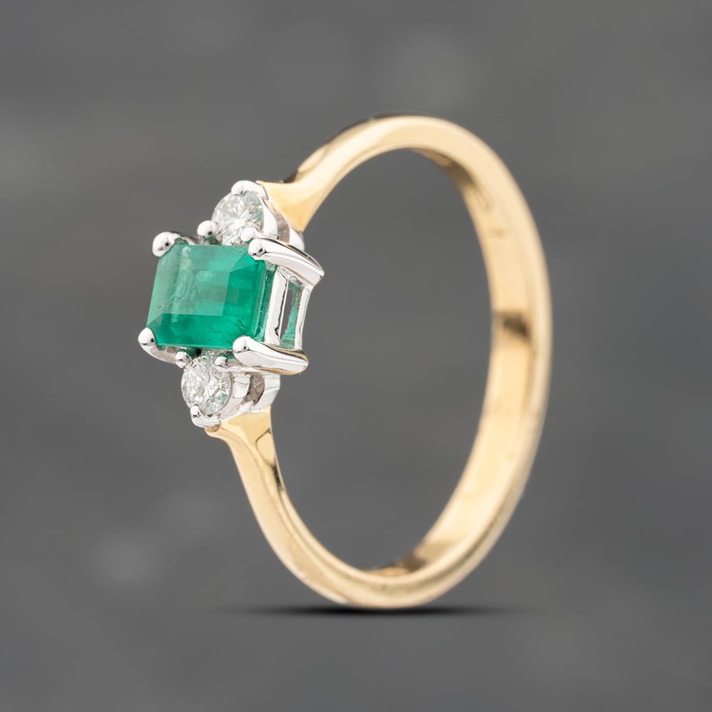 Click to view product details and reviews for Pre Owned 18ct Yellow Gold 030ct Emerald And 008ct Brilliant Cut Diamond Three Stone Ring 43371083.