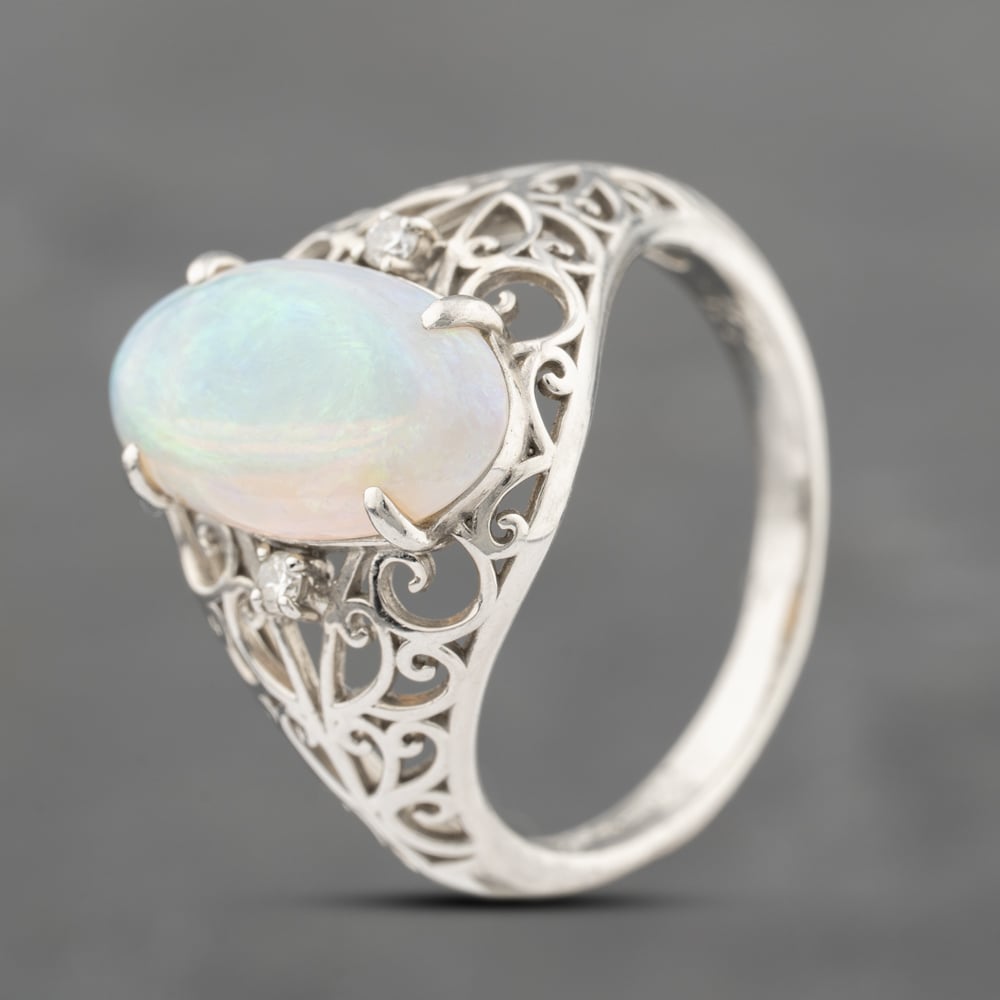 Click to view product details and reviews for Pre Owned Platinum 271ct Opal And 005ct Diamond Oval Dress Ring 43381022.