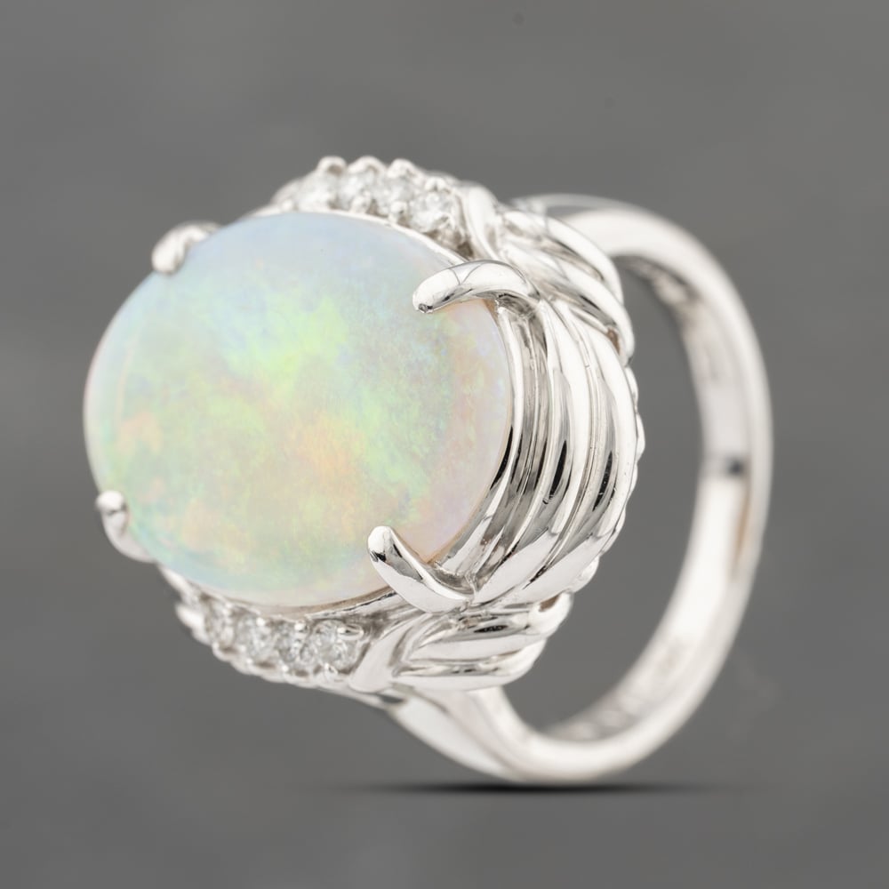 Click to view product details and reviews for Pre Owned Platinum 401ct Opal And 011ct Diamond Oval Dress Ring 43381027.