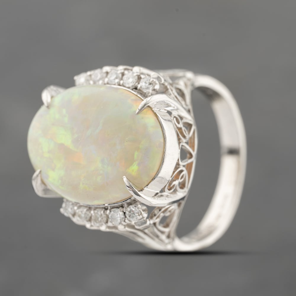 Click to view product details and reviews for Pre Owned Platinum 515ct Opal And 023ct Diamond Oval Dress Ring 43381032.