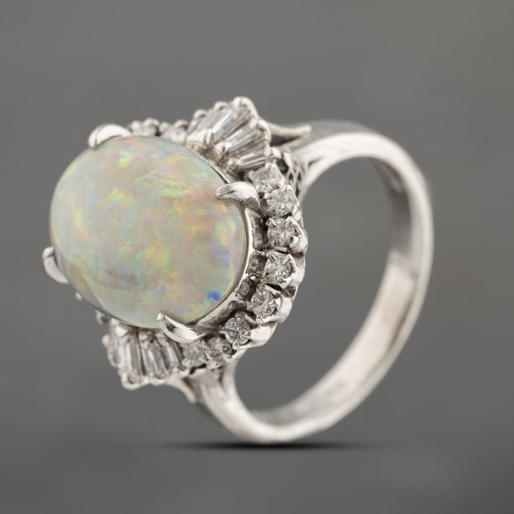 Click to view product details and reviews for Pre Owned Platinum 491ct Opal And 044ct Diamond Oval Cluster Ring 43381035.